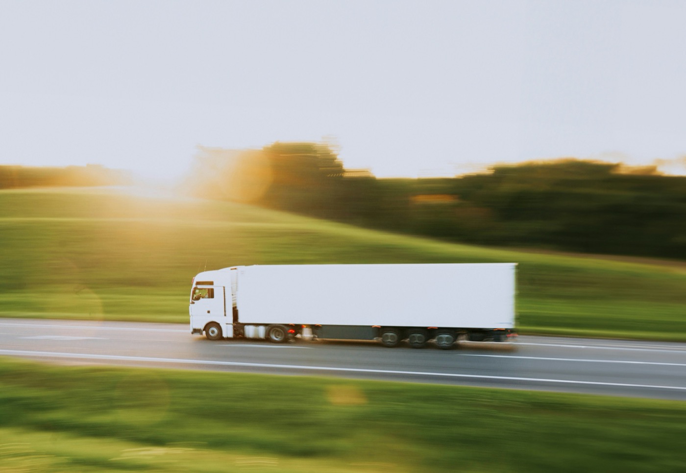 A moving truck on the highway, coordinating relocation logistics